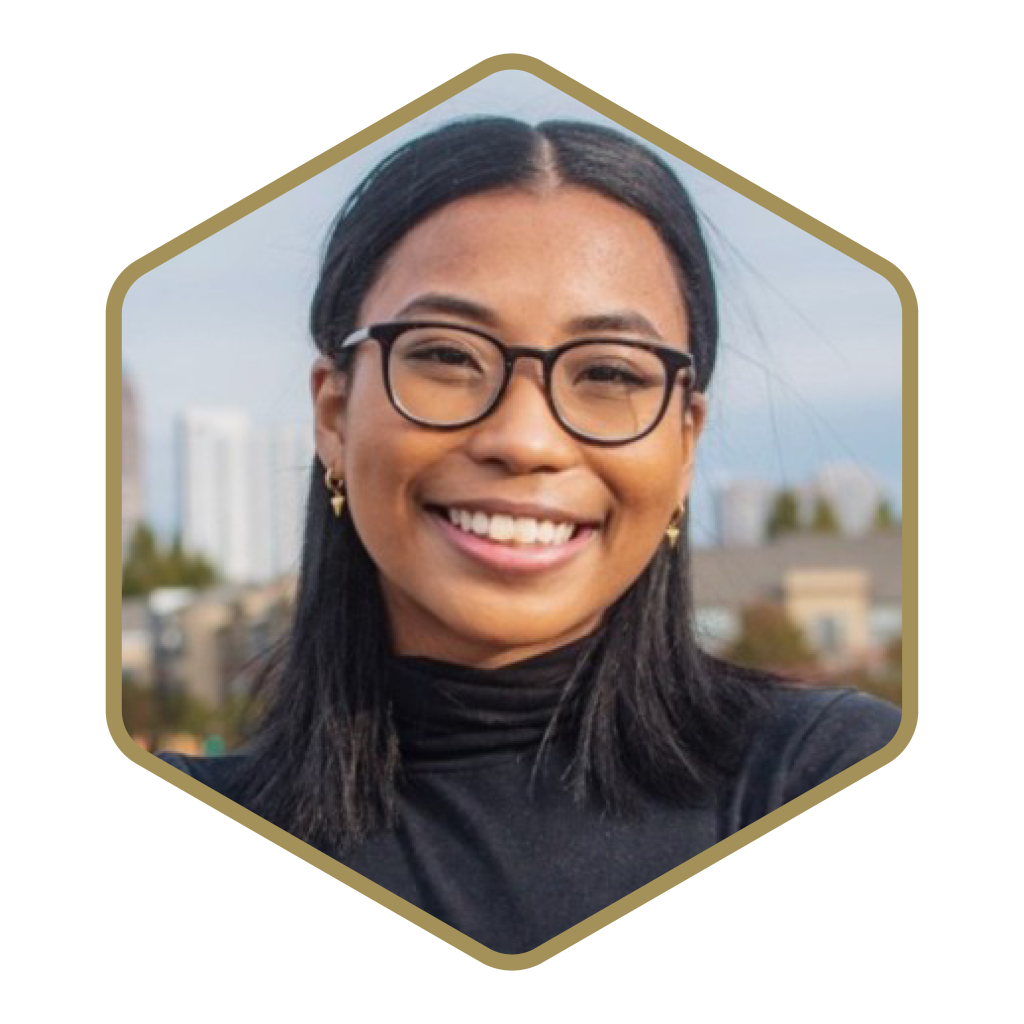 Headshot of Mia Floyd in a gold hexagon frame.