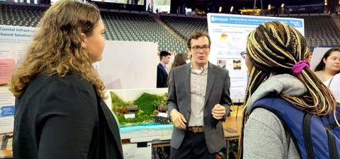 Students present research project at fair.