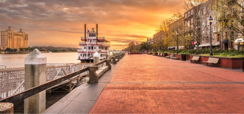 Savannah, Georgia, USA riverfront promenade at sunrise.