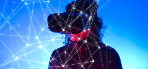 Person wearing VR glasses on a blue gradient background with network lines displayed digitally in front of them
