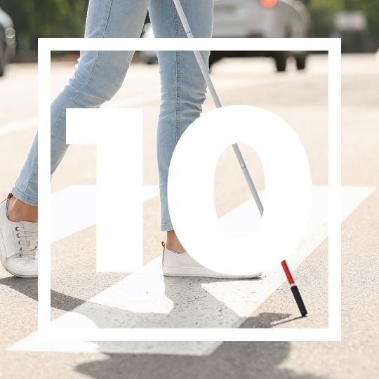 stock image of a visually impaired woman walking with a cane and the number 10 in large font on top of it.