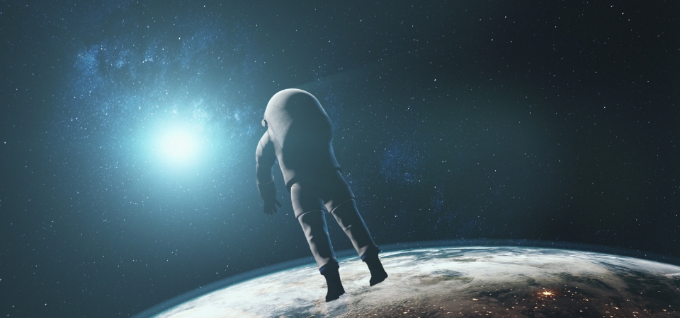 Astronaut against realistic planet Earth starlight. Back view of spaceman in outer space illuminated mainland surface. 3d animation. Science and technology. Elements of this media furnished by NASA.