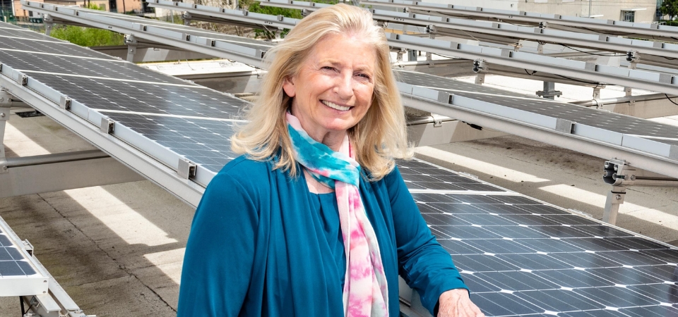 Marilyn Brown with solar panels.