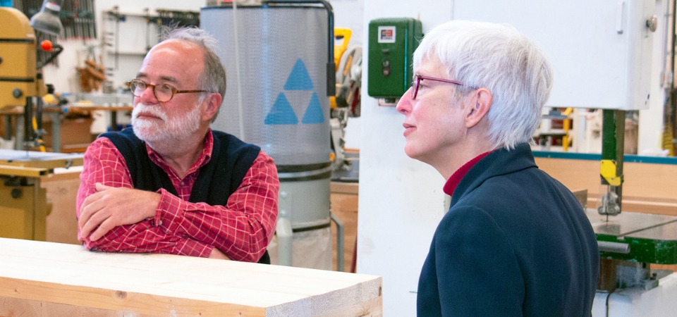 Two faculty who hold joint appointments working in a lab.