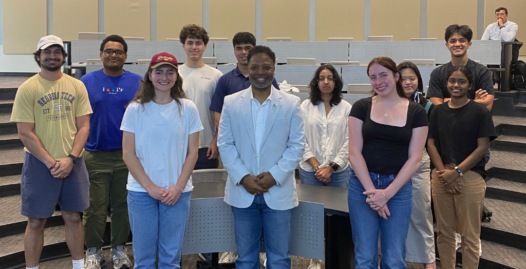 Students pose with guest speaker Michael Owens at the club's Cyber and Defense Policy event. Owens is the mayor of Mableton, Georgia, and a cybersecurity expert.