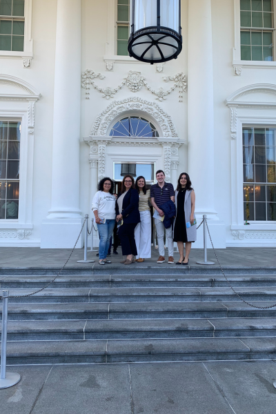 Washington visitors pose in front of the door to the White House