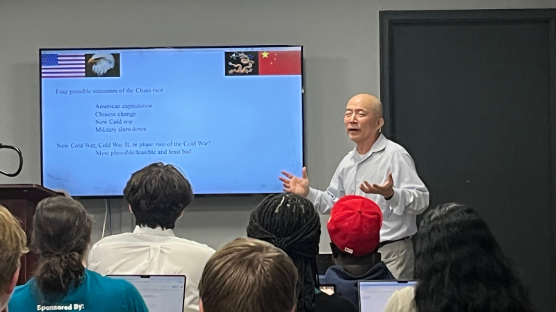 Fei-Ling Wang presents to a group at the "Navigating the US-China Relationship" presentation on Sunday, Oct. 20, 2024. The event also featured Adm. (ret.) Sandy Winnefeld, Distinguished Professor of the Practice in the Nunn School.