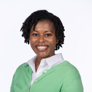 Lauren Hunter poses with a smile in front of a white background.