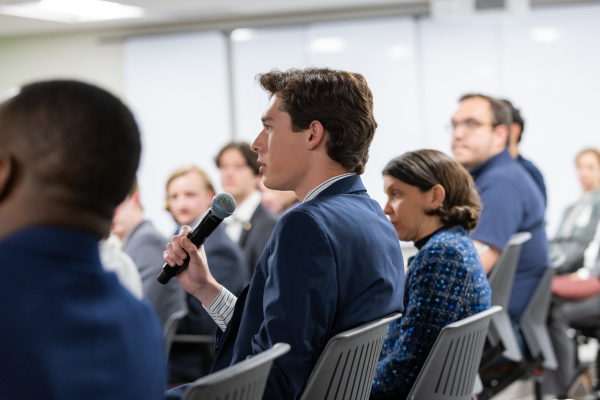 Members of the audience listen to the panel