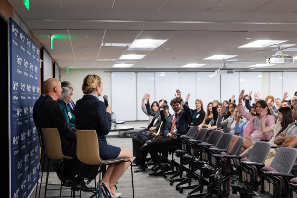 Panelists Ellen Bassett, Richard Utz, Devesh Ranjan, Cassidy Sugimoto, and Dene Sheheane speak in front of a room full of GTDC students and Georgia Tech faculty.