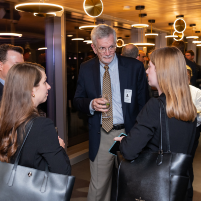 Richard Barke speaks with a group of students.