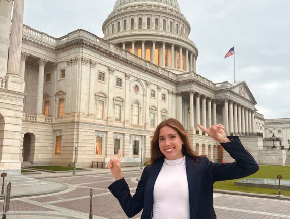 Cotsman posing in front of the US Capitol building in Washington, DC.