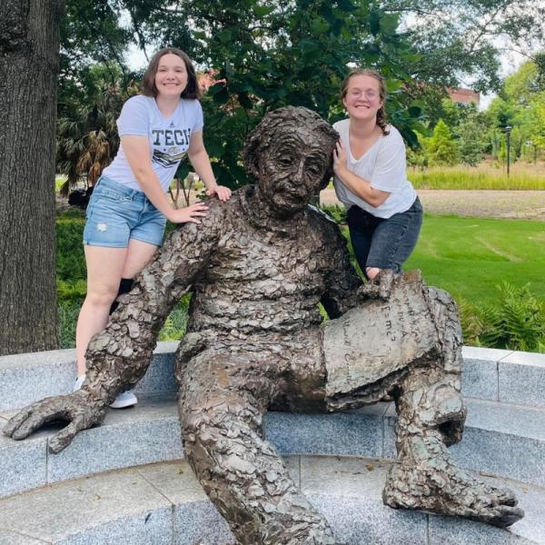 Sarah Richardson posing with the Einstein statue on campus