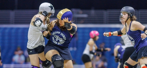 Rodriguez Dalmau, center, competing with the Yellow Jacket Roller Derby.