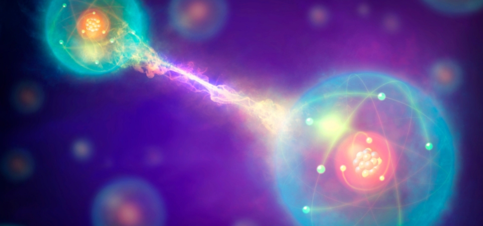 Artistic illustration of quantum entanglement showing two glowing atoms connected by a stream of energy, surrounded by electrons and set against a colorful, abstract space-like background.