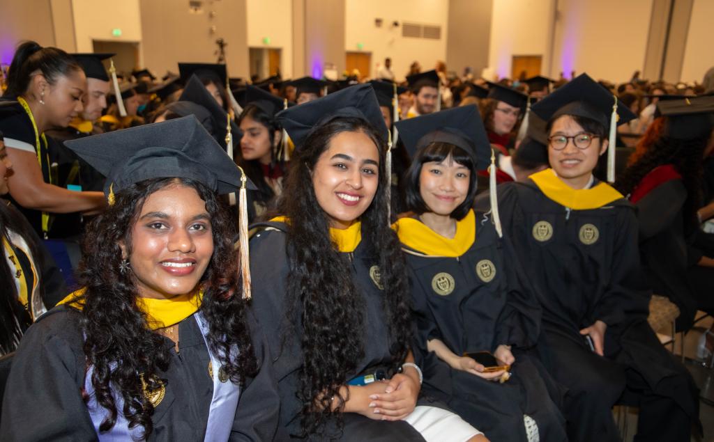 grads chatting/posing before the ceremony