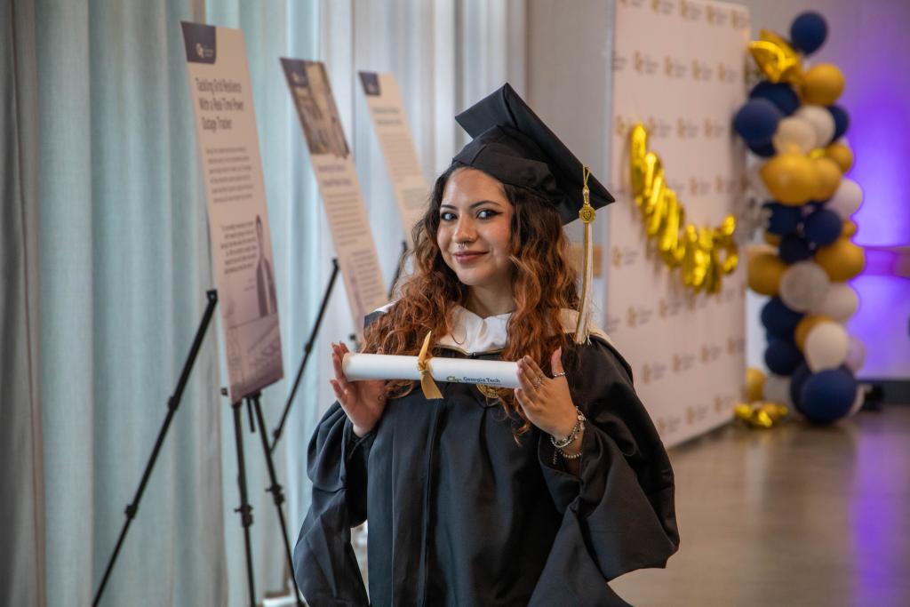 student receiving diploma