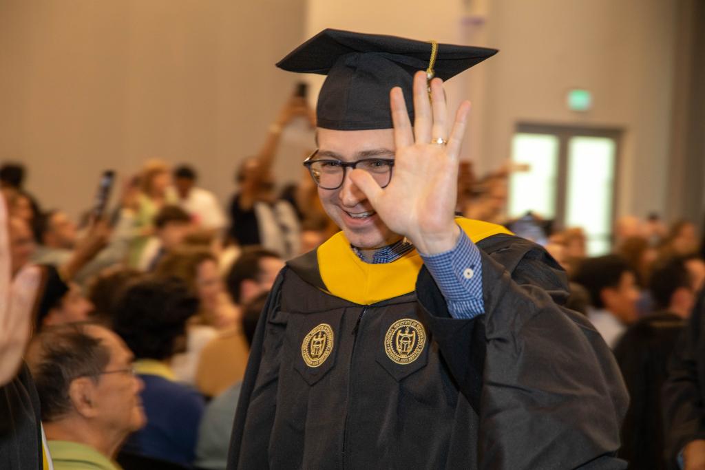 grad waving during ceremony