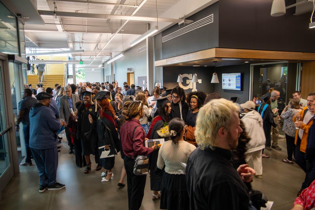 guests mingling with grads after the ceremony