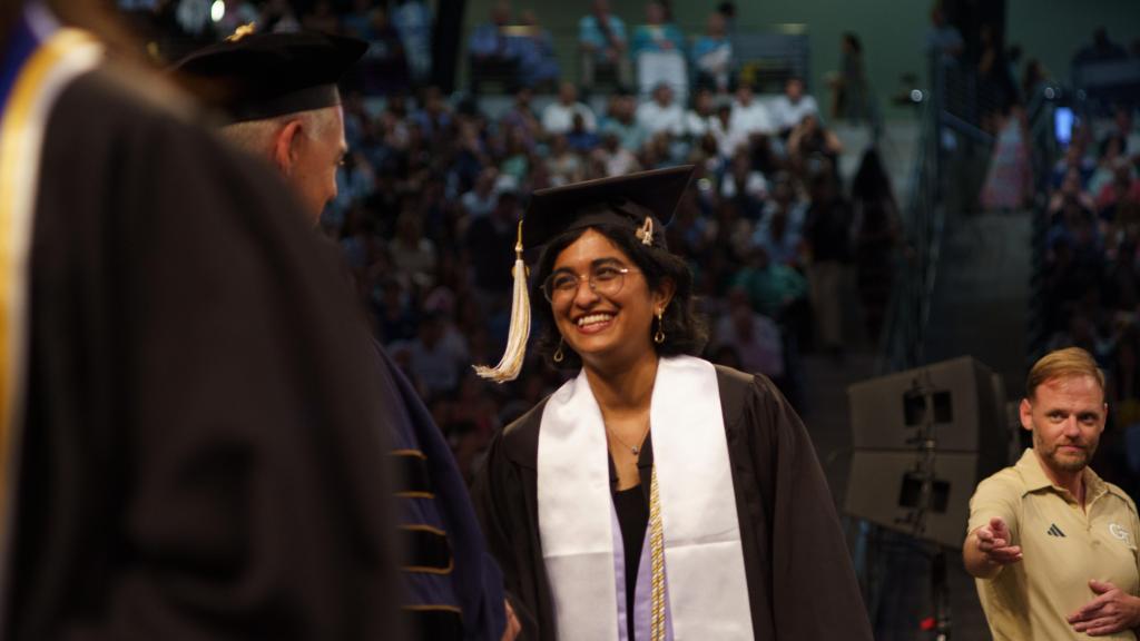 student receiving their diploma from Cabrera
