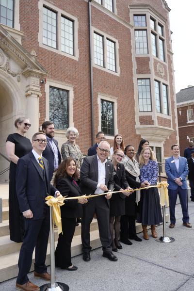 President Cabrera and others holding a ceremonial ribbon and scissors preparing to cut at the D.M. Smith Renovation Celebration event on Jan. 7, 2026.