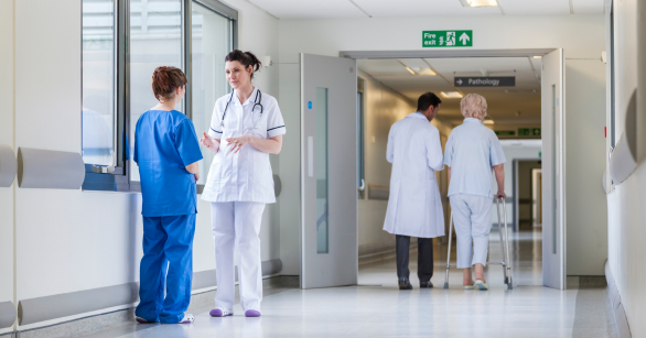 Hospital hallway with doctors