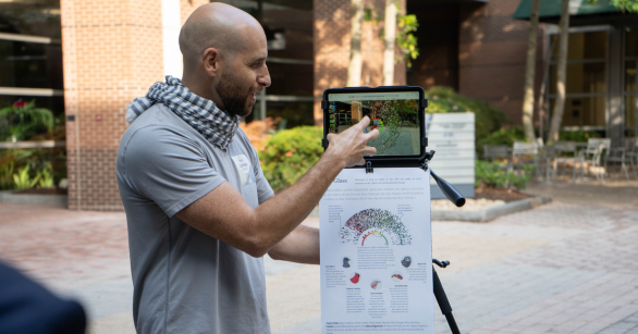 Digital Media faculty member Yanni Loukisses demonstrating a project