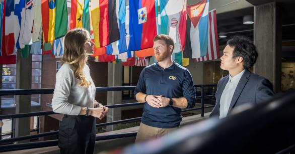 International Affairs students and faculty in the flag building