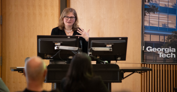 economisc professor Olga Shemyakina speaking at a conference at Georgia Tech