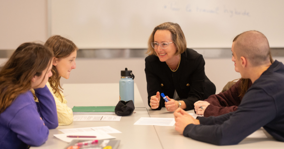 students working with professor in french class at Georgia Tech