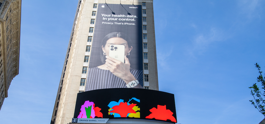 a digital billboard on a building showing colorful flowers