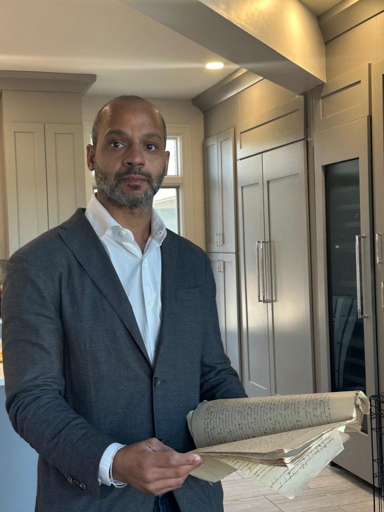  Beaulieu with his great-grandfather's journal. He is transcribing a portion of it for his final project in the M.S. ALIS degree.  