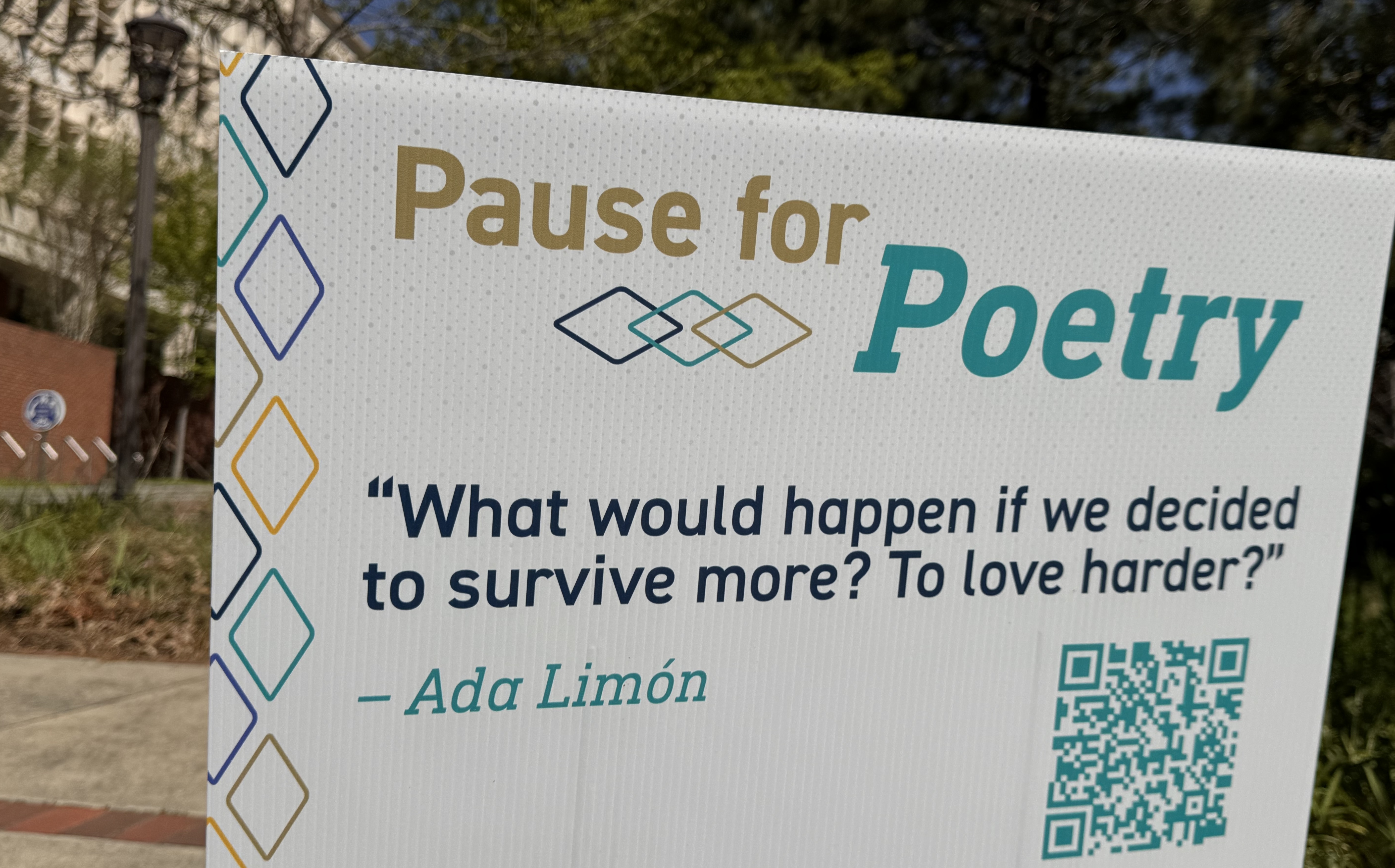a "pause for poetry" sign on Georgia Tech's campus that reads "What would happen if we decided to survive more? To love harder?" - Ada Limón