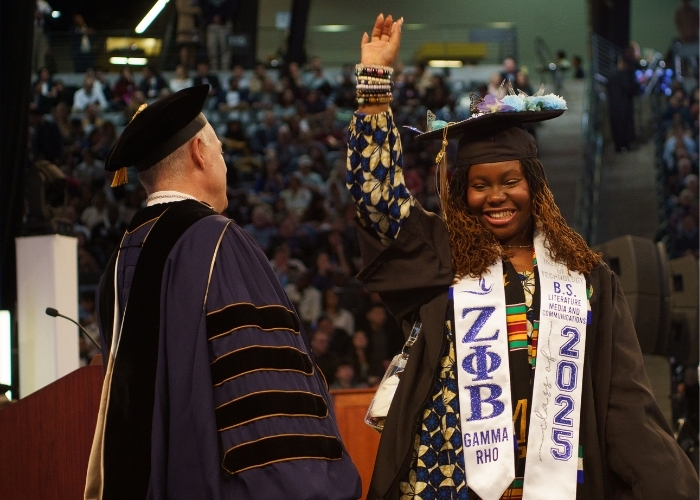 Student graduating with a B.S. in Literature, Media, and Communication