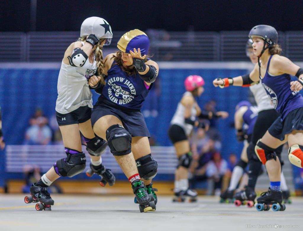 Rodriguez Dalmau, center, competing with the Yellow Jacket Roller Derby 