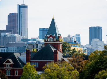 Georgia Tech's Tech Tower with skyscrapers in the background.