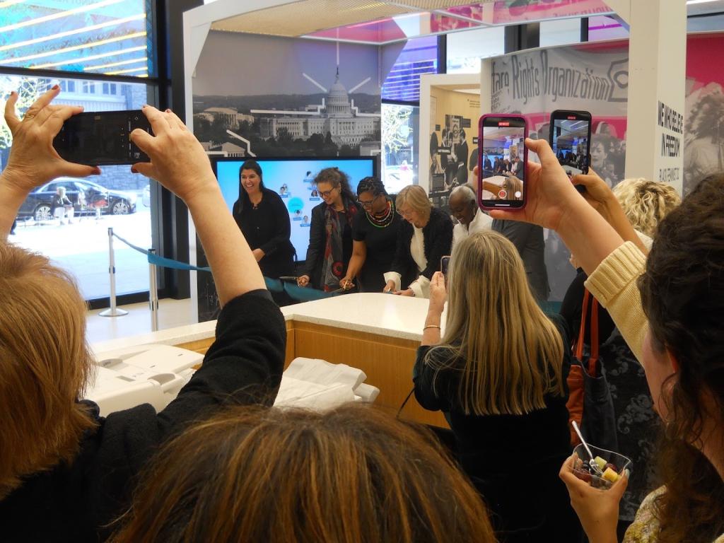 Randolph cutting tape at her exhibit in Washington, D.C.