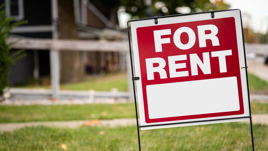 A rental sign in the front yard of a home