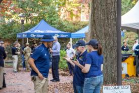 People mingling at the homecoming tailgate