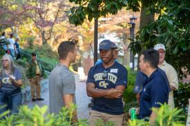 Alumni mingling at the homecoming tailgate