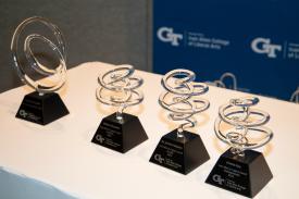 a set of awards on a table