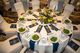 a banquet table laid out with menus